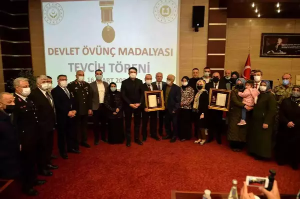 Şehit ailesi ve gazilere övünç madalyaları törenle verildi... Yazıcı: 