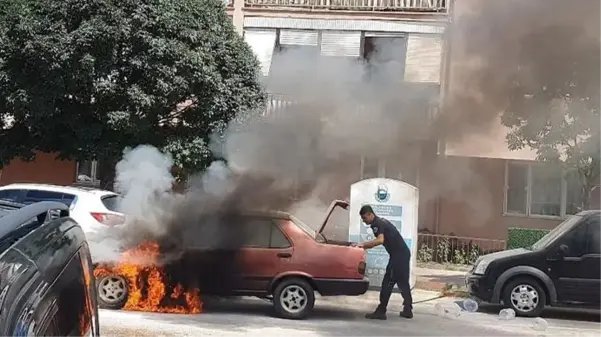 Alev topuna dönen otomobilinin içine girdi