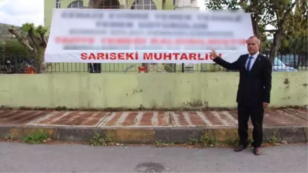 Yeni seçilen muhtardan cenaze yemekleri için afişli uyarı